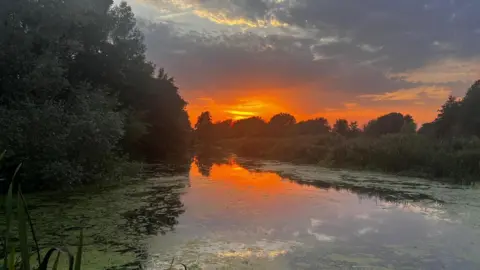 A sun setting over Falcon Meadow at Bungay. 