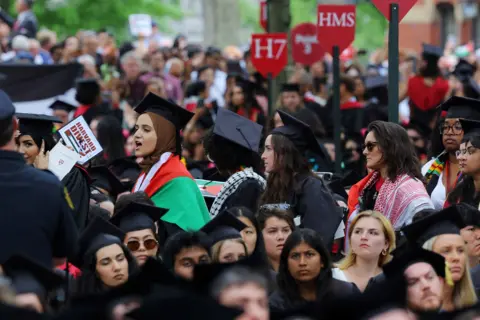 Harvard students leave graduation