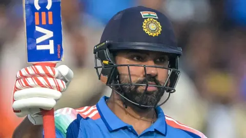 Rohit Sharma celebrates his half-century