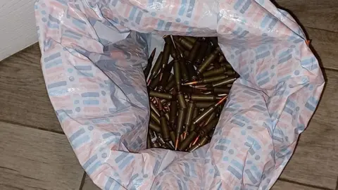 North Yorkshire Police A plastic carrier bag containing a large number of bullets.