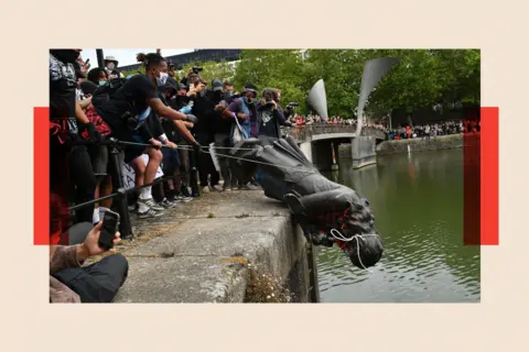 PA The statue of Edward Colston being dropped into Bristol harbour during a Black Lives Matter protest rally.