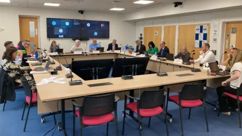 Councillors sat around a square table.