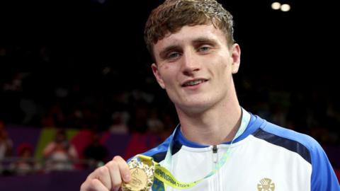 Sam Hickey with his Commonwealth Games gold medal