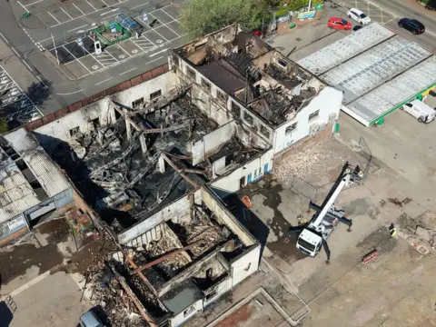 Scottish Drone Adventures a burnt out building with collapsed roof in the rubble