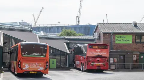 Transport Nottingham Two buses parked at Victoria Bus Station, a single story building with glazed walls