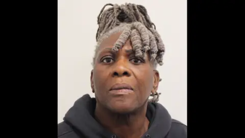 A custody photo of Janice Nix. She is wearing a black hooded top. 