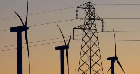 Reuters wind turbines and an electricity pylon.