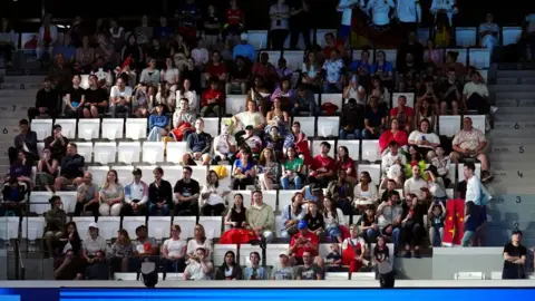 PA Media Empty seats are pictured during a sporting event at the Paris Olympics