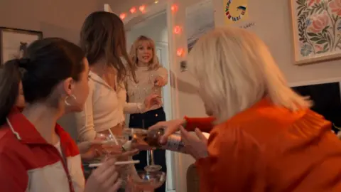 Amanda catches Gan-Gan pouring drinks for the girls