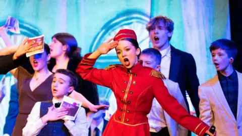 Royal Grammar School Children on stage during a musical show