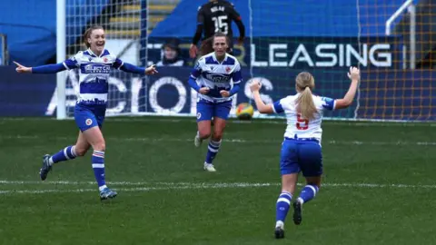 Getty Images Reading players celebrate scoring a goal at the SCL Stadium. 