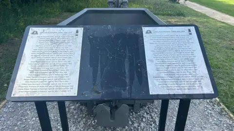 Damaged panels at the Colliers Wood nature reserve miners memorial