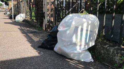 Bin bags outside homes in Kent