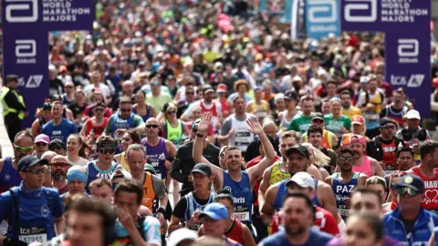 Fun runners cross Tower Bridge during the 2024 London Marathon