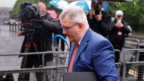 Sir Jeffrey Donaldson arriving at Newry Crown Court on Thursday in a blue suit