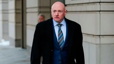 Senator Mark Kelly outside federal court in Washington DC in February 