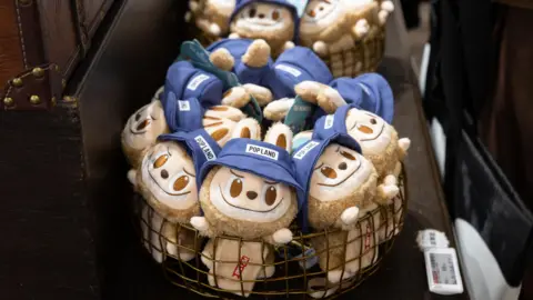 A basket filled with Labubu toys - plush toys of monster elves