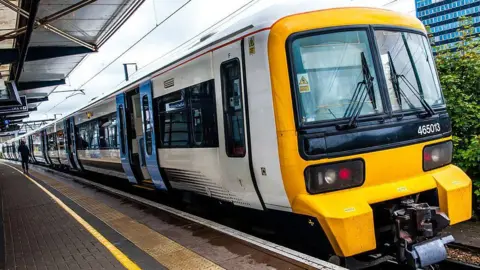 A close-up shot of a white and black train. 