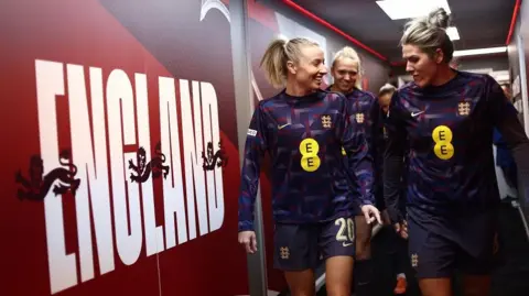 Getty Images Leah Williamson and Millie Bright of England make their way out to warm up ahead of the Women's international friendly between England and Switzerland at Bramall Lane on December 03, 2024 in Sheffield