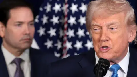 A close up of Donald Trump speaking, with Marco Rubio out of focus in the background.