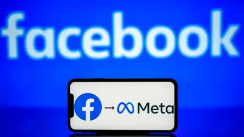 Getty Images A blue background with the word FACEBOOK in white - in front of that is a phone with the Facebook logo an arrow then the Meta logo