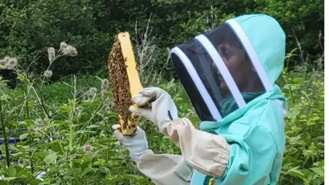 Surrey Bees Archie in his beekeeping kit 