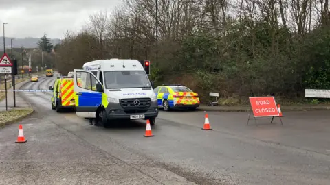 Simon Thake / BBC Emergency services at the scene in Donetsk Way, Sheffield