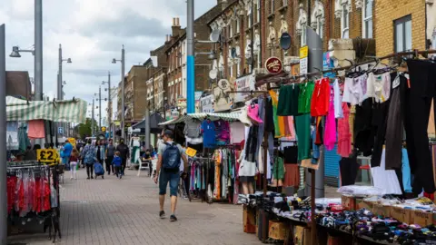 Getty Images A view of traders and shoppers at Walthamstow market. 
