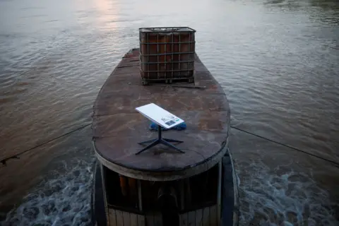 Reuters A Starlink satellite internet system is installed on a miners' boat on the Madeira River in Porto Velho, Rondônia state, Brazil.