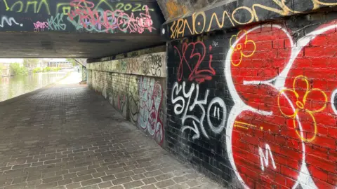 Canal with graffiti scribbled on the walls