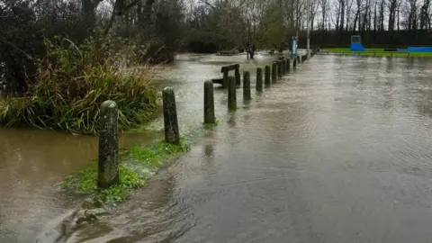 A heavily flooded ground, in a park