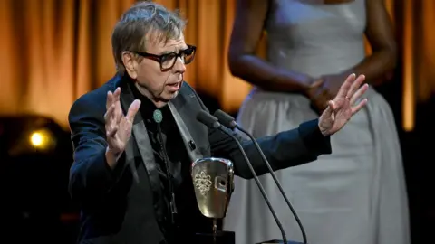 Getty Images Timothy Spall accepts the Leading Actor Award for 'The Sixth Commandment' onstage during the 2024 BAFTA Television Awards with P&O Cruises at The Royal Festival Hall on May 12, 2024 in London, England. 