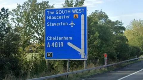 Google A photo of a road sign, which reads "the south west, gloucester, staverton, cheltenham"