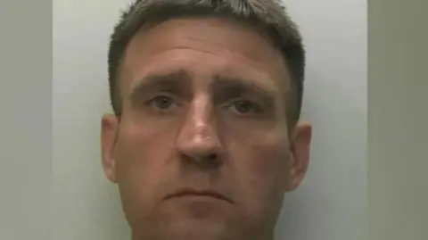 Devon and Cornwall Police A mugshot of Guy Sullivan