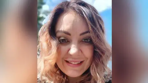 Robbie MacDonald/LDRS Labour councillor Samara Barnes with long dark blond hair and nose ring wearing a leopard print furry coat. She is smiling. 