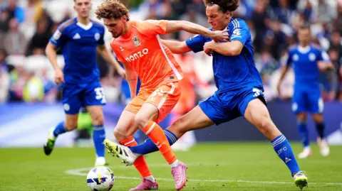 PA Coventry City's Jack Rudoni (left) and Leicester City's Wout Faes battle for the ball during the Sky Bet Championship match at King Power Stadium, Leicester