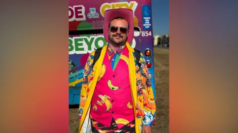 A man in a colourful outfit.