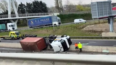 Supplied A lorry on its side on the A14 by Bar Hill, Cambridgeshire