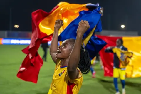 Jalal Morchidi / EPA / Shutterstock Female football players from Chad in yellow shirts celebrate and wave the national flag on the pitch - Saturday 1 November 2025.