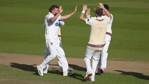 Somerset celebrate taking a wicket