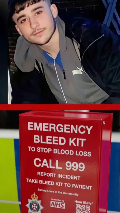 A split screen image of Owen Dunn and an emergency bleed kit. Owen has short dark hair and stubble on his upper lip and jawline. The bleed kit pictured underneath his photo is red and covered in white writing instructing users to call 999. The NHS logo and an ambulance trust logo are also on the box.