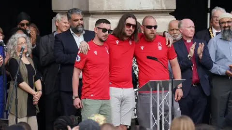 PA Media Coates brother at vigil in Nottingham's Market Square on 16 June 2023 after the Nottingham attacks