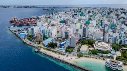 Getty Images A general view of the city during daily life in Male, Maldives on December 05, 2023. Male, is the capital of the Maldives, an island country in the Indian Ocean whose economy is largely based on tourism.