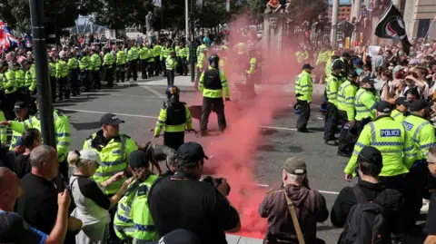 PA Media Police and protestors face off in Liverpool