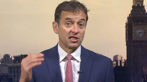 Man in suit with pink tie