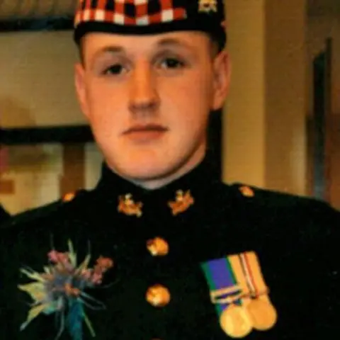 Ministry of Defence Sean Binnie in army uniform looking at camera, he is wearing medals.