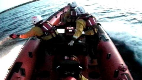 RNLI crews out at sea trying to locate the two anglers