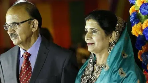BBC Mamta and Neeraj Pathak, a middle-aged Indian couple. Mamta Pathak (right) was sentenced to life for killing her husband, Neeraj (left) by electrocution.
