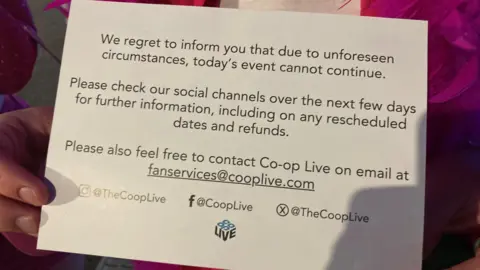 Cards carrying an announcement from Co-op Live were handed out to fans