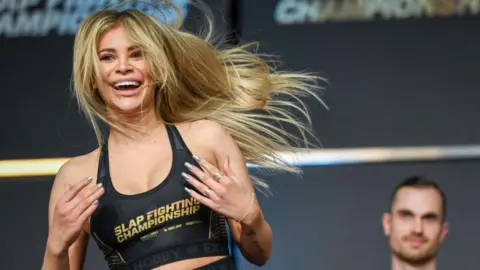 Getty Images/Gaelen Morse Adrianna “Flychanelle” Śledź smiles arsenic  she celebrates during a slap-fighting contention  successful  Ohio